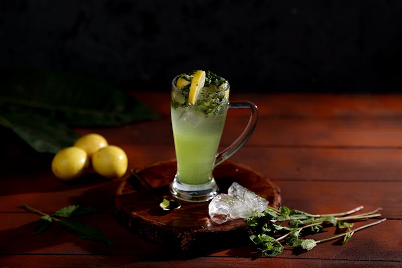 Fresh craft lemonade with mint leaves in a tall glass
